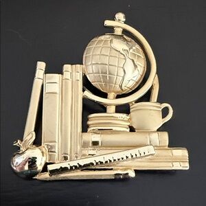 Vintage gold-tone AJC teacher-themed brooch